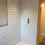 White shower tiling in Oxfordshire