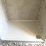 Ensuite shower area with grey tiles in Oxfordshire