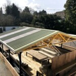 Green metal coverway roof in Oxfordshire